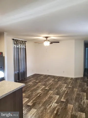 a view of a livingroom with a hallway
