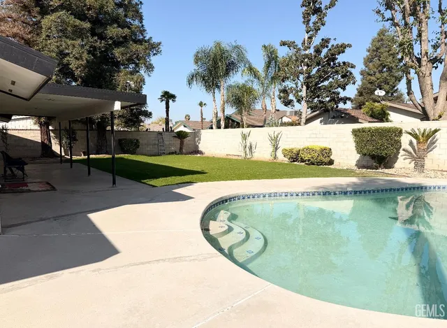 a view of swimming pool from a outdoor space