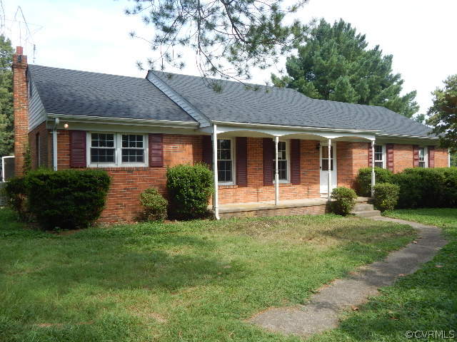 18178 Teman Road Beaverdam, VA 23015 - Photo 1 of 2 a view of a house with a yard and plants with large windows