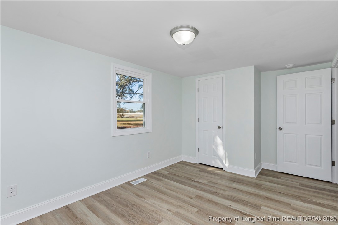 1340 George Perry Lee Road Dunn, NC 28334 - Photo 26 of 31 wooden floor in an empty room
