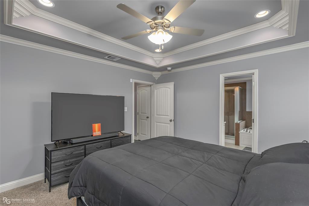 4917 Players Loop Blanchard, LA 71107 - Photo 22 of 31 a bedroom with a bed and a tv