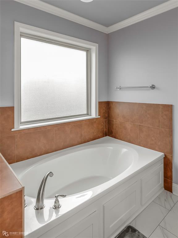 4917 Players Loop Blanchard, LA 71107 - Photo 25 of 31 a bathroom with a bathtub and window