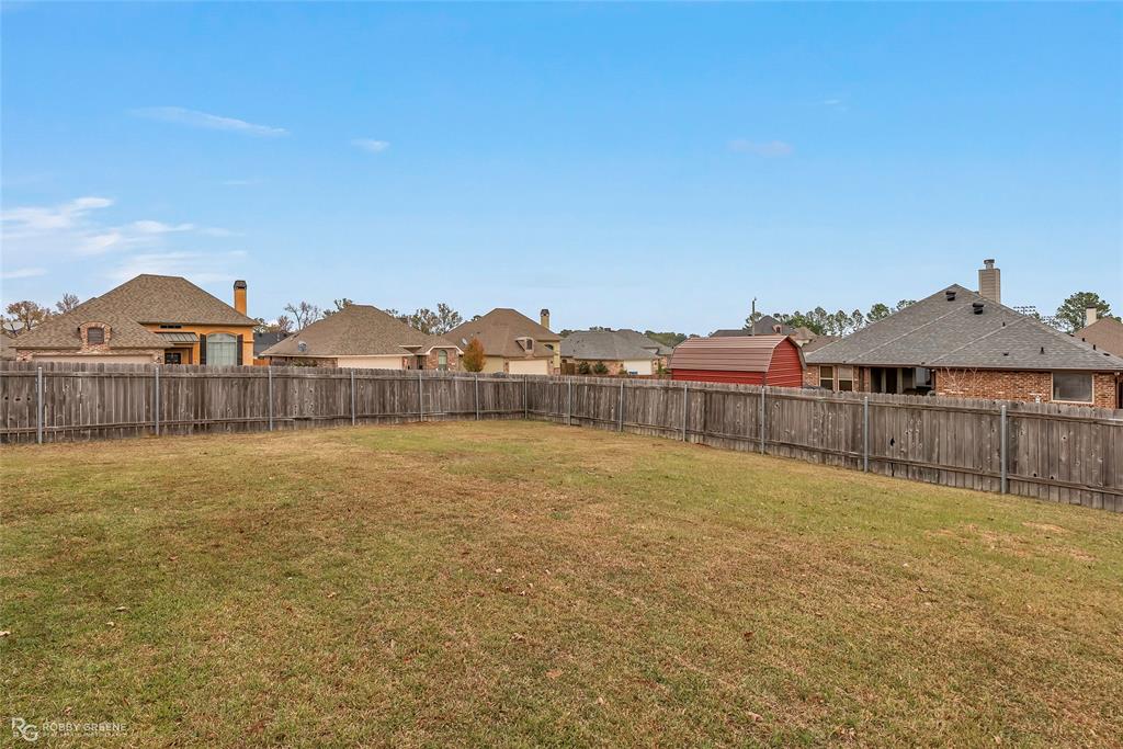 4917 Players Loop Blanchard, LA 71107 - Photo 5 of 31 a view of a house with a garden and a yard