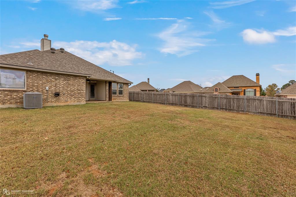 4917 Players Loop Blanchard, LA 71107 - Photo 6 of 31 a view of a house with a yard