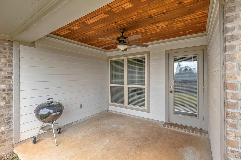 4917 Players Loop Blanchard, LA 71107 - Photo 8 of 31 a view of a livingroom with wooden floor and a ceiling fan