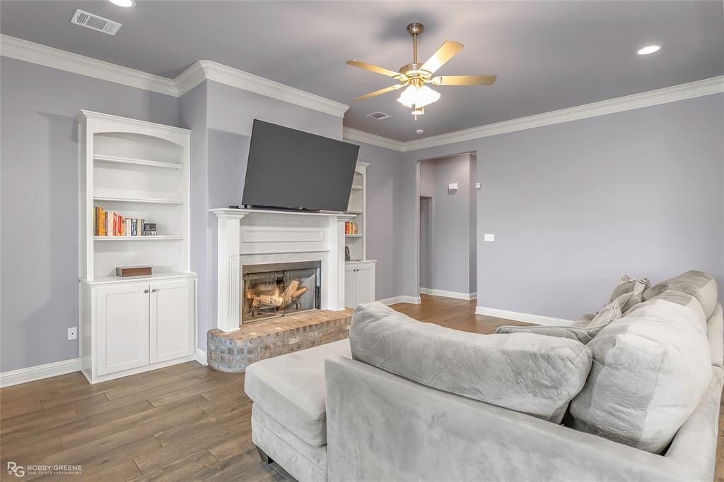 4917 Players Loop Blanchard, LA 71107 - Photo 9 of 31 a living room with furniture fireplace and flat screen tv