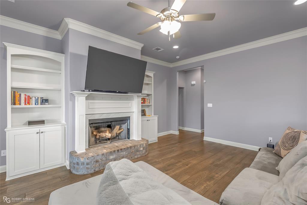4917 Players Loop Blanchard, LA 71107 - Photo 10 of 31 a living room with furniture a flat screen tv and a fireplace