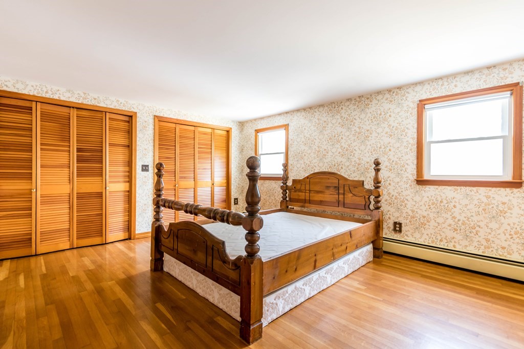 10 Dowd Avenue Wareham, MA 02571 - Photo 15 of 34 a bed sitting in a spacious bedroom next to a window
