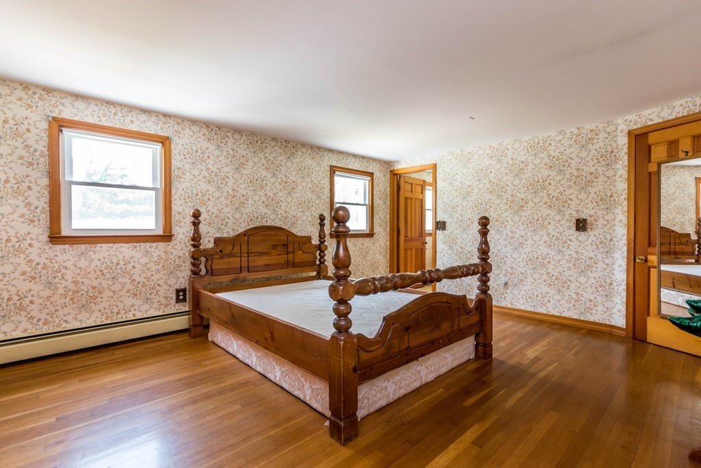 10 Dowd Avenue Wareham, MA 02571 - Photo 16 of 34 a bed sitting in a bedroom next to a window