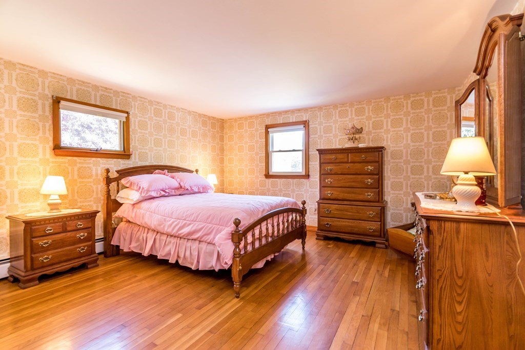 10 Dowd Avenue Wareham, MA 02571 - Photo 18 of 34 a bedroom with a bed and wooden floor