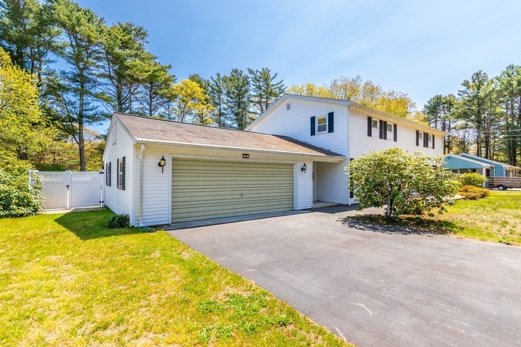 10 Dowd Avenue Wareham, MA 02571 - Photo 29 of 34 a front view of a house with a yard and garage