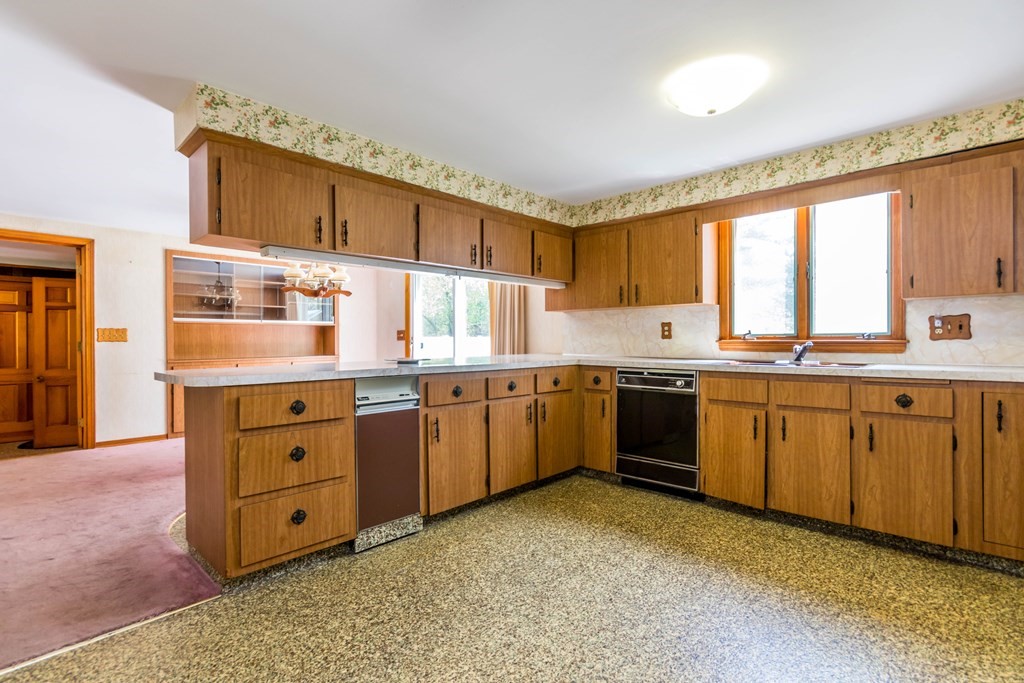 10 Dowd Avenue Wareham, MA 02571 - Photo 8 of 34 a kitchen with stainless steel appliances granite countertop a stove sink and cabinets