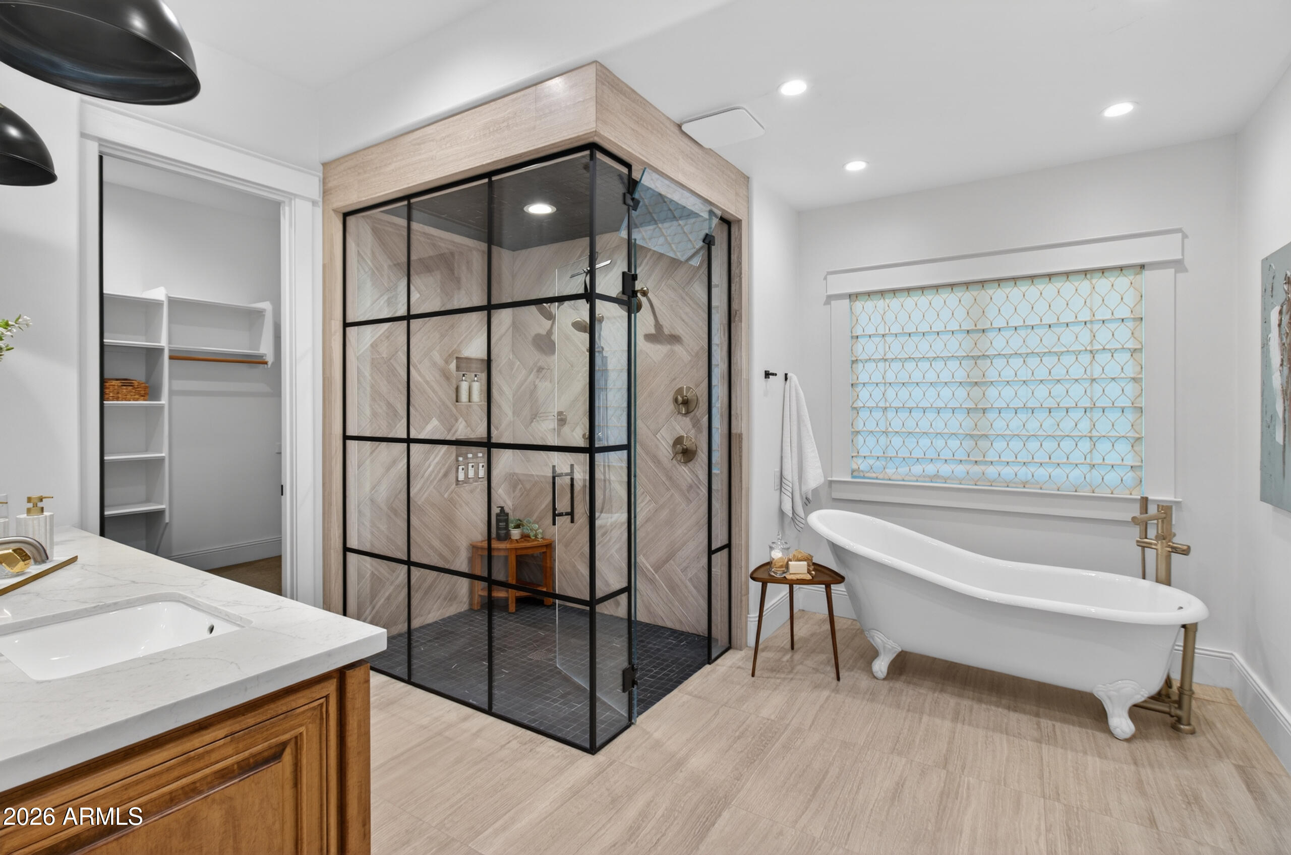 2677 East Queen Creek Road Gilbert, AZ 85297 - Photo 47 of 128 a bathroom with a tub and a sink