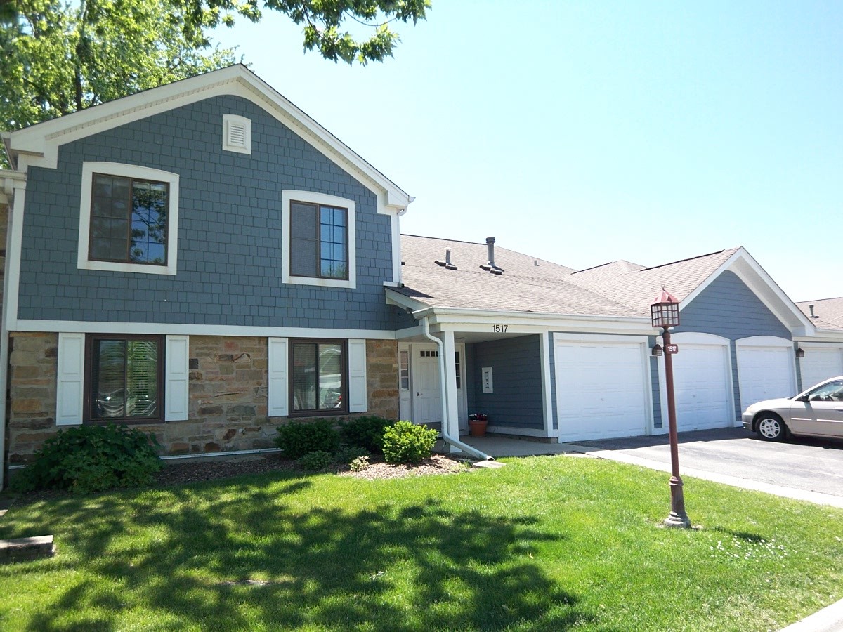 1517 7 Pines Road, Unit C2 Schaumburg, IL 60193 - Photo 1 of 34 a front view of a house with a yard