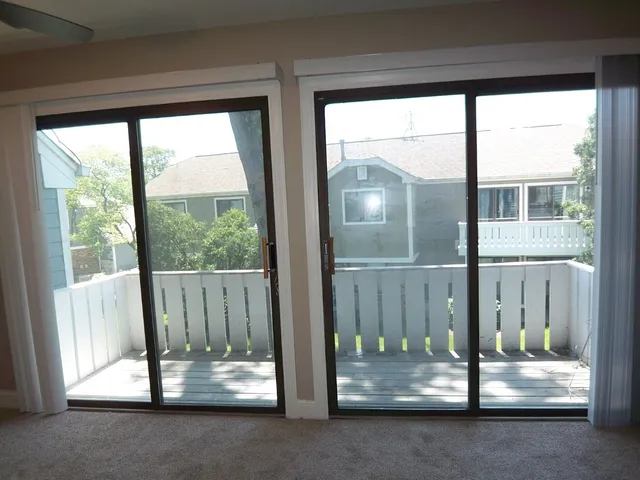 a front view of a house with a floor to ceiling window