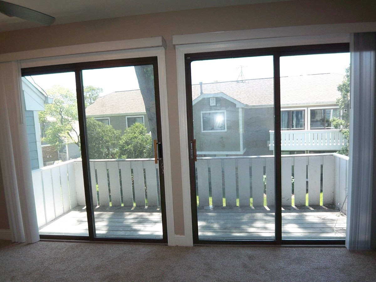 1517 7 Pines Road, Unit C2 Schaumburg, IL 60193 - Photo 11 of 34 a front view of a house with a floor to ceiling window