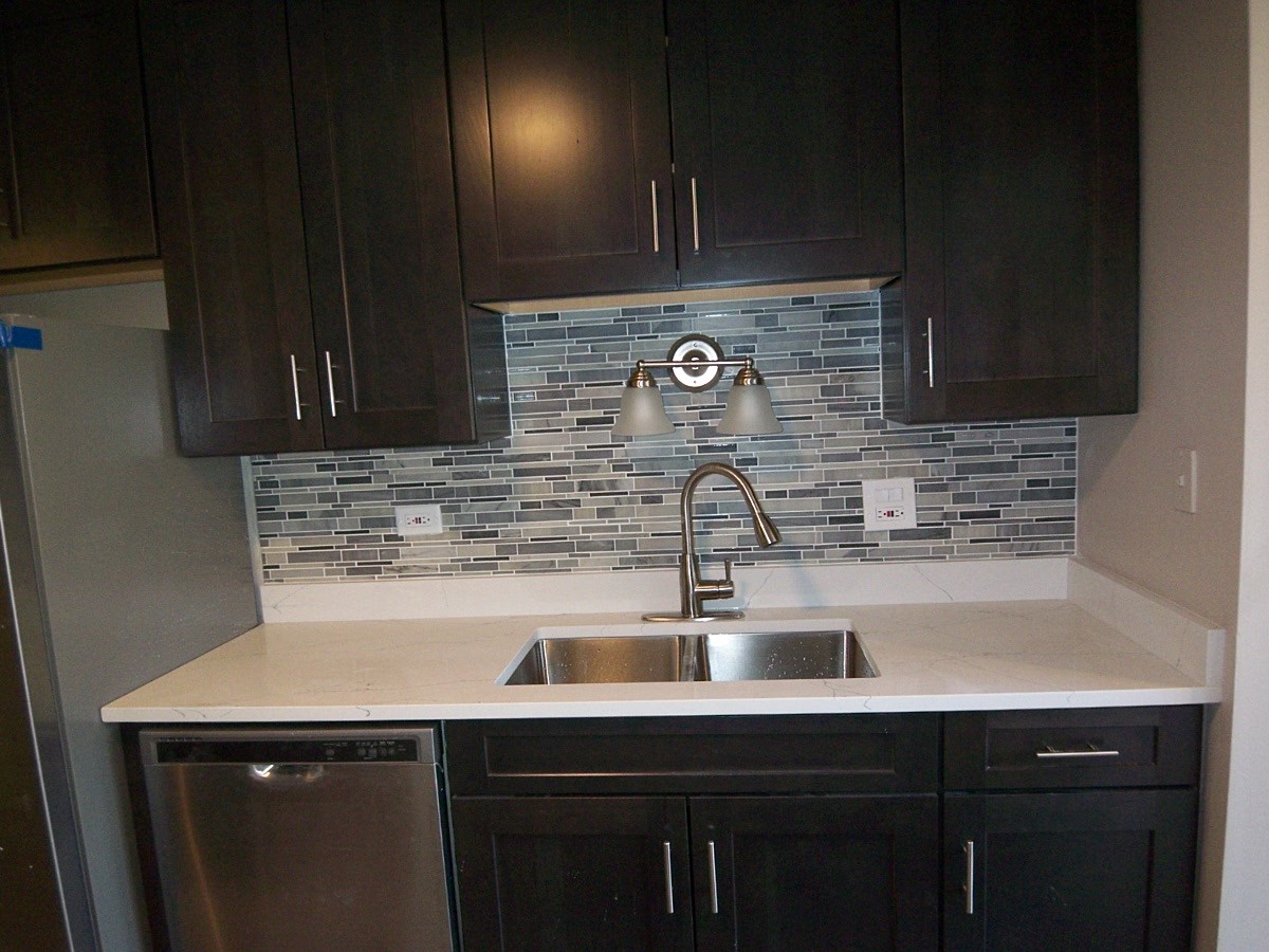 1517 7 Pines Road, Unit C2 Schaumburg, IL 60193 - Photo 19 of 34 a kitchen with a sink and cabinets