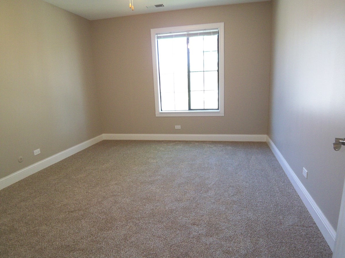 1517 7 Pines Road, Unit C2 Schaumburg, IL 60193 - Photo 22 of 34 an empty room with a window
