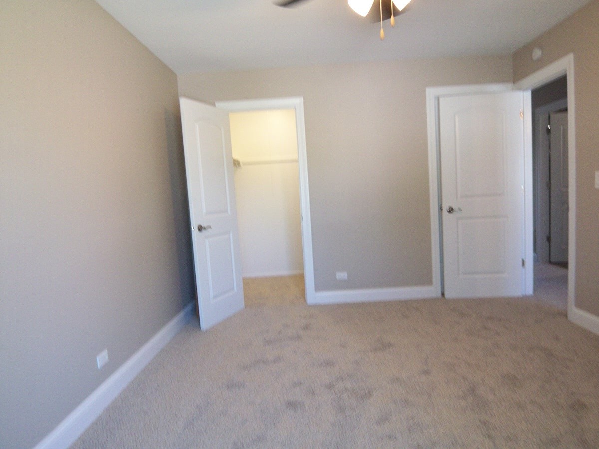 1517 7 Pines Road, Unit C2 Schaumburg, IL 60193 - Photo 23 of 34 an empty room with windows