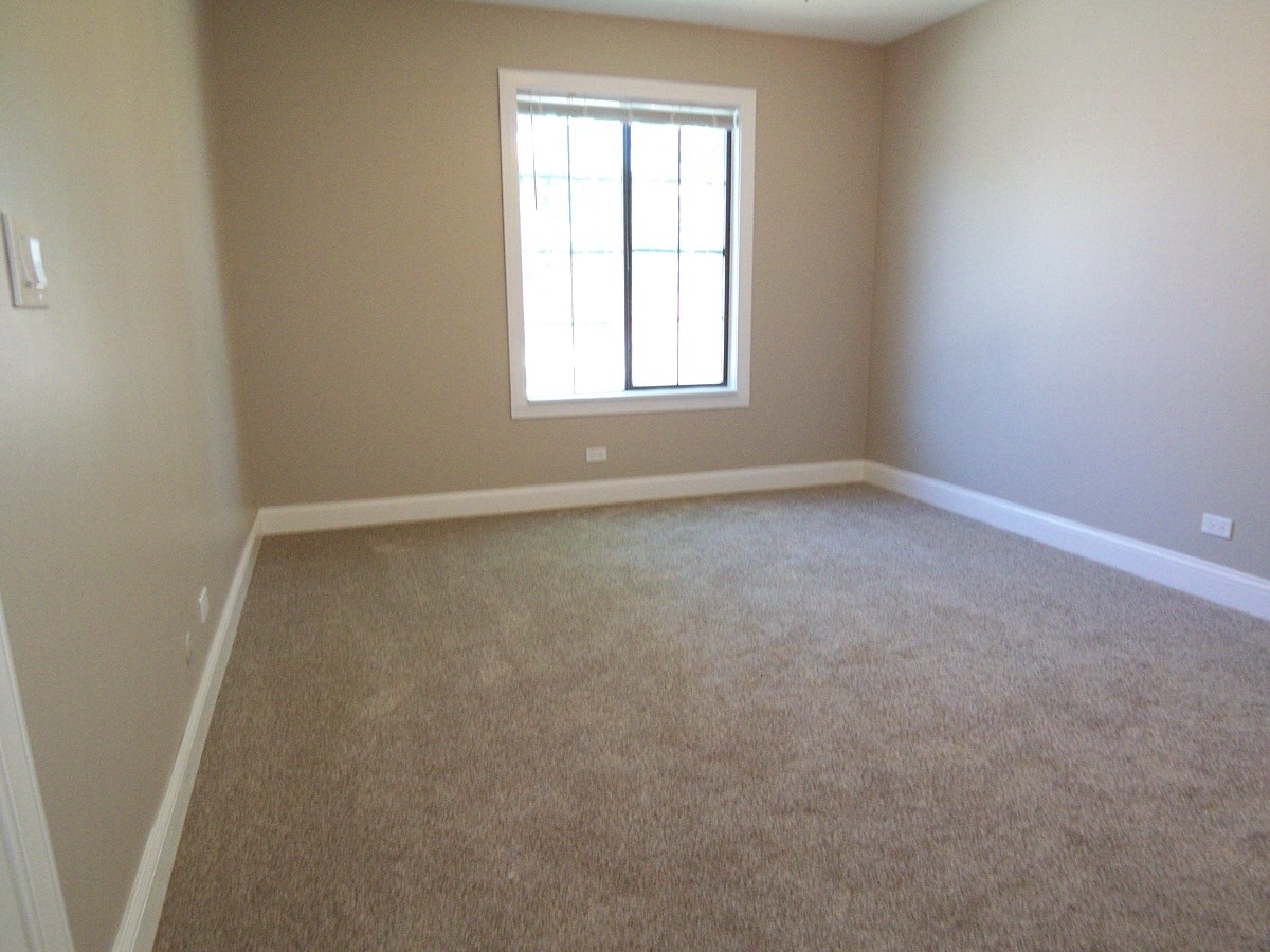 1517 7 Pines Road, Unit C2 Schaumburg, IL 60193 - Photo 26 of 34 an empty room with a window