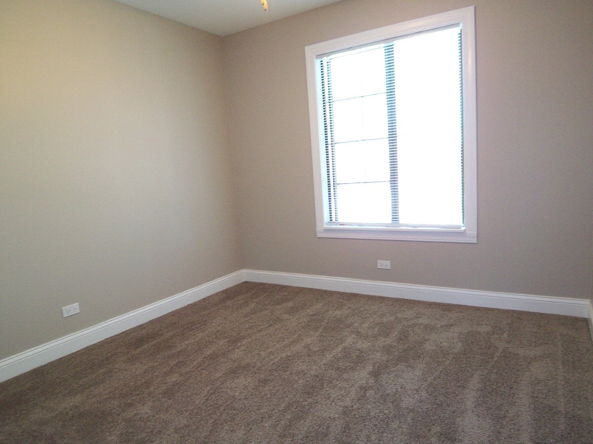 1517 7 Pines Road, Unit C2 Schaumburg, IL 60193 - Photo 28 of 34 an empty room with a window