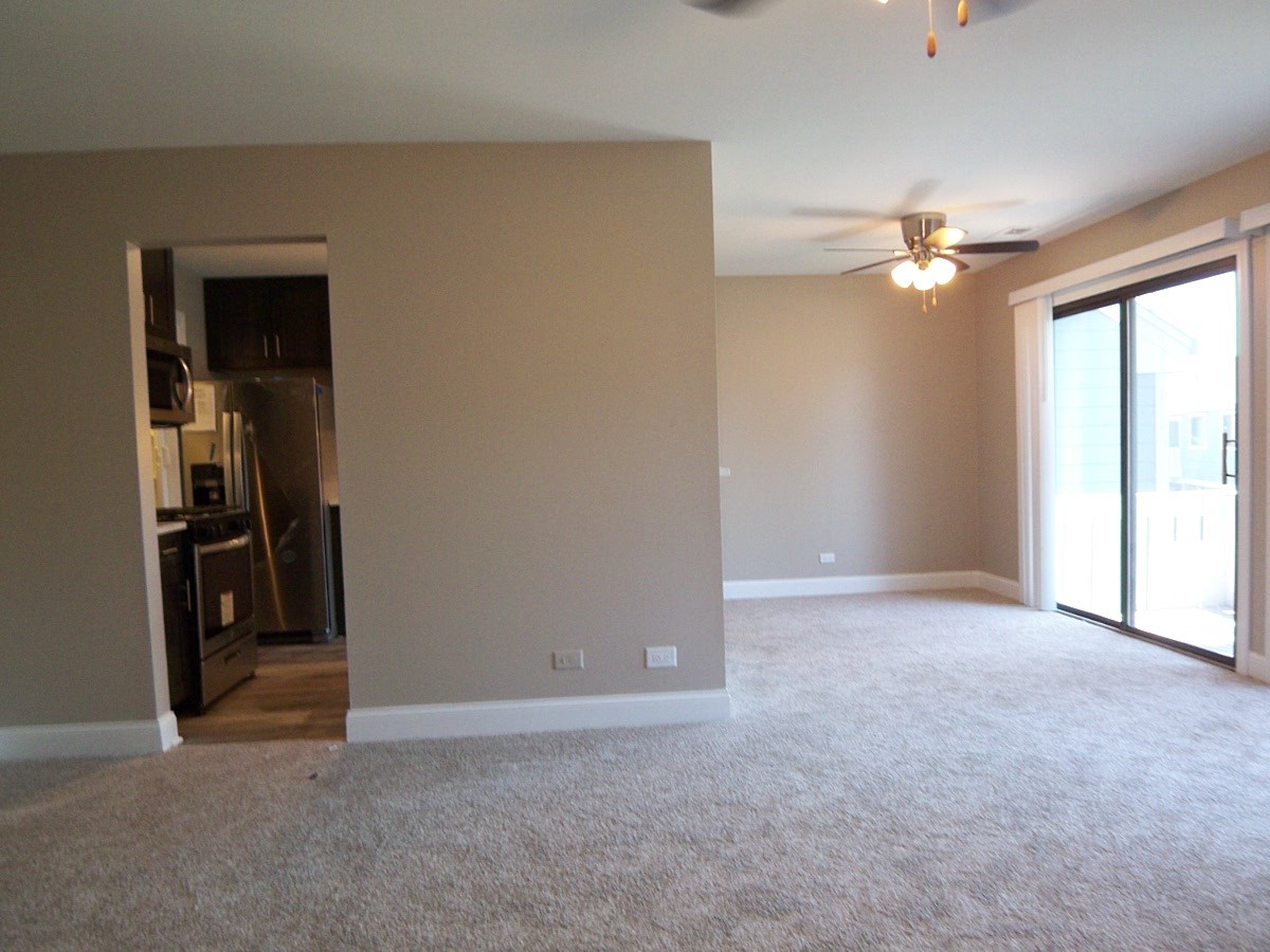 1517 7 Pines Road, Unit C2 Schaumburg, IL 60193 - Photo 4 of 34 a view of empty room with chandelier fan