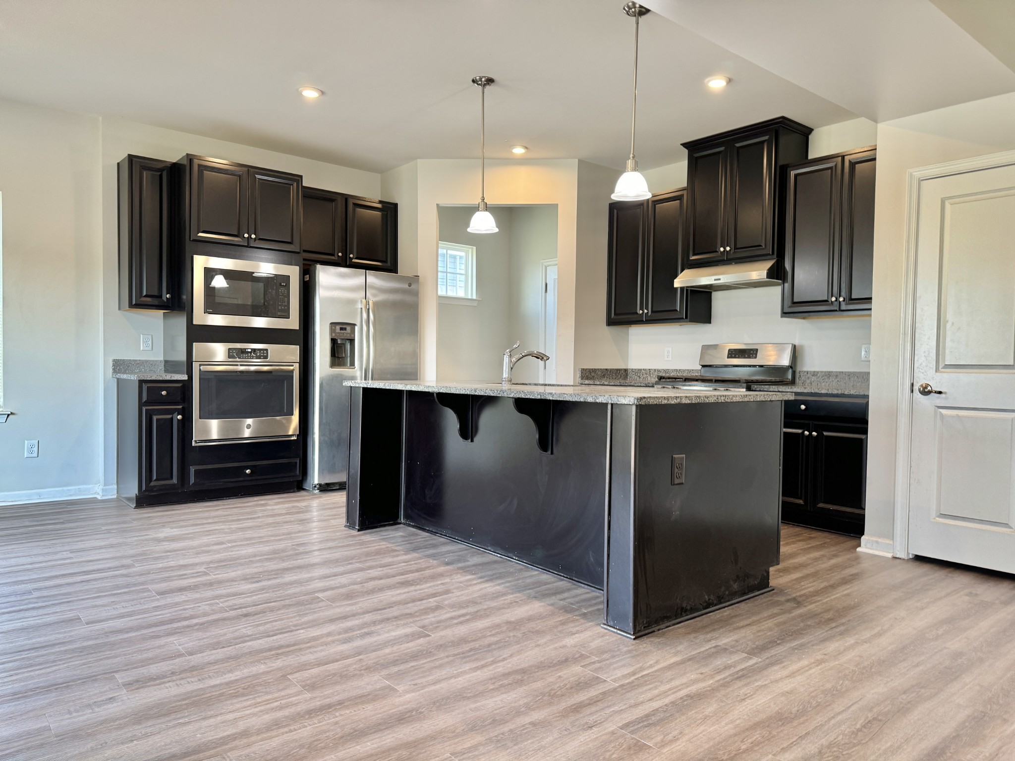 3209 Garrett Lane Columbia, TN 38401 - Photo 7 of 30 a kitchen with stainless steel appliances granite countertop a refrigerator and a sink
