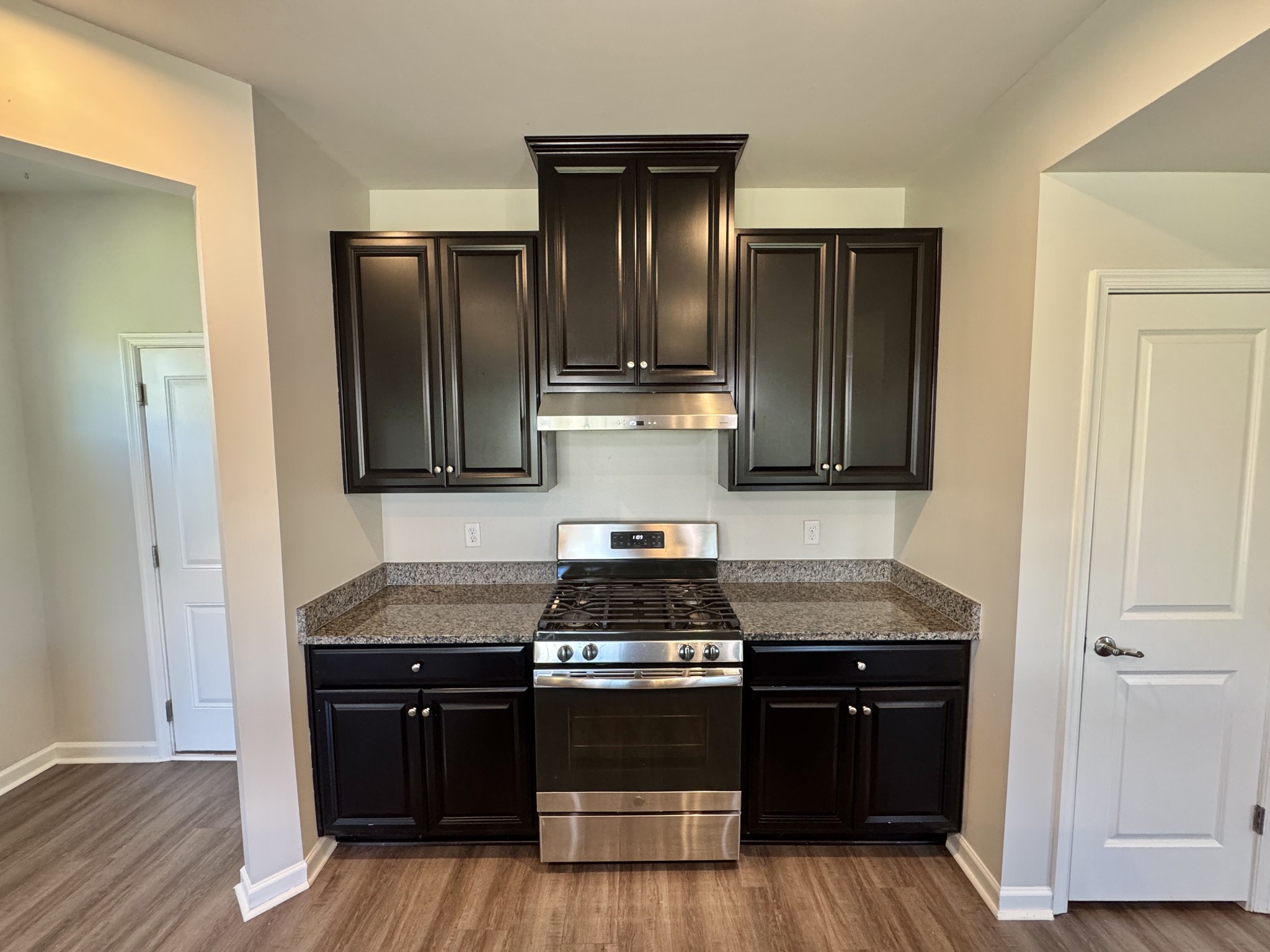 3209 Garrett Lane Columbia, TN 38401 - Photo 10 of 30 a kitchen with granite countertop stainless steel appliances and wooden cabinets