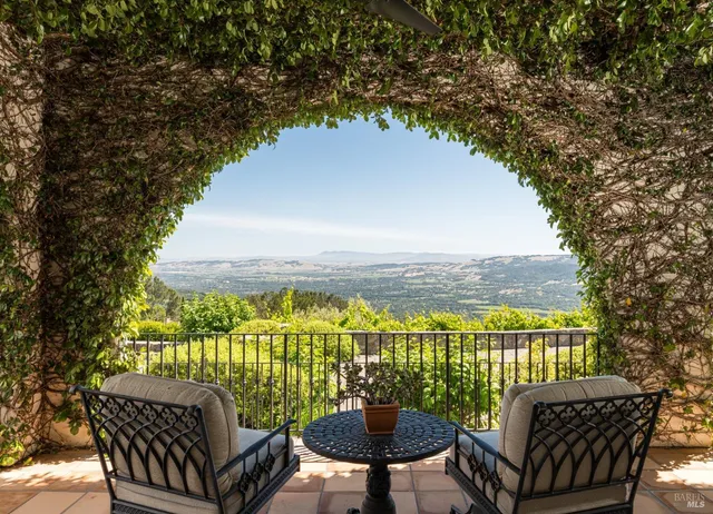 a view of a balcony with chairs
