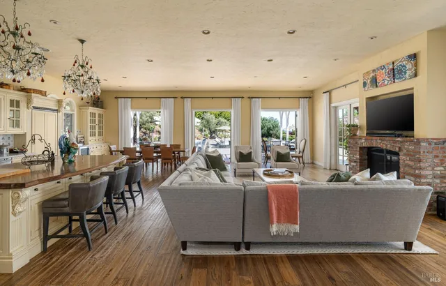 a living room with fireplace furniture and a flat screen tv