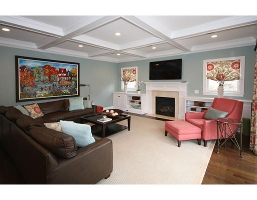 18 Colgate Road Needham, MA 02492 - Photo 11 of 23 a living room with furniture a flat screen tv and a fireplace