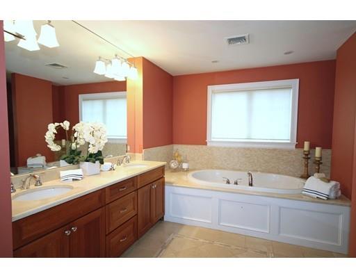 18 Colgate Road Needham, MA 02492 - Photo 14 of 23 a bathroom with a tub sink and mirror