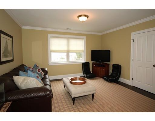 18 Colgate Road Needham, MA 02492 - Photo 18 of 23 a living room with furniture and a flat screen tv