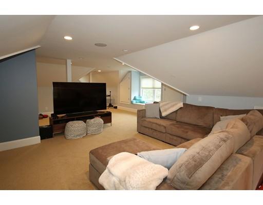18 Colgate Road Needham, MA 02492 - Photo 21 of 23 a living room with furniture and a flat screen tv