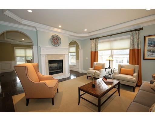 18 Colgate Road Needham, MA 02492 - Photo 4 of 23 a living room with furniture a fireplace and a large window