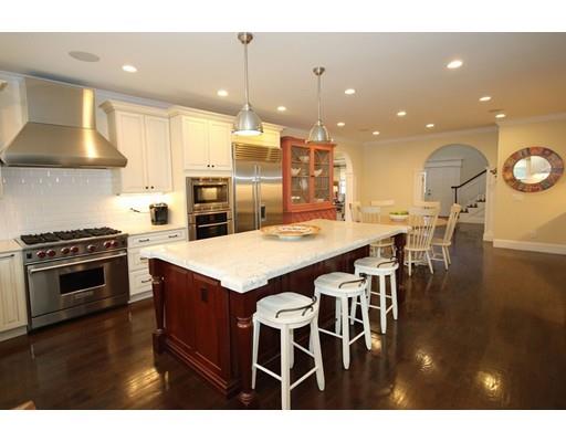 18 Colgate Road Needham, MA 02492 - Photo 9 of 23 a kitchen with a table and chairs in it