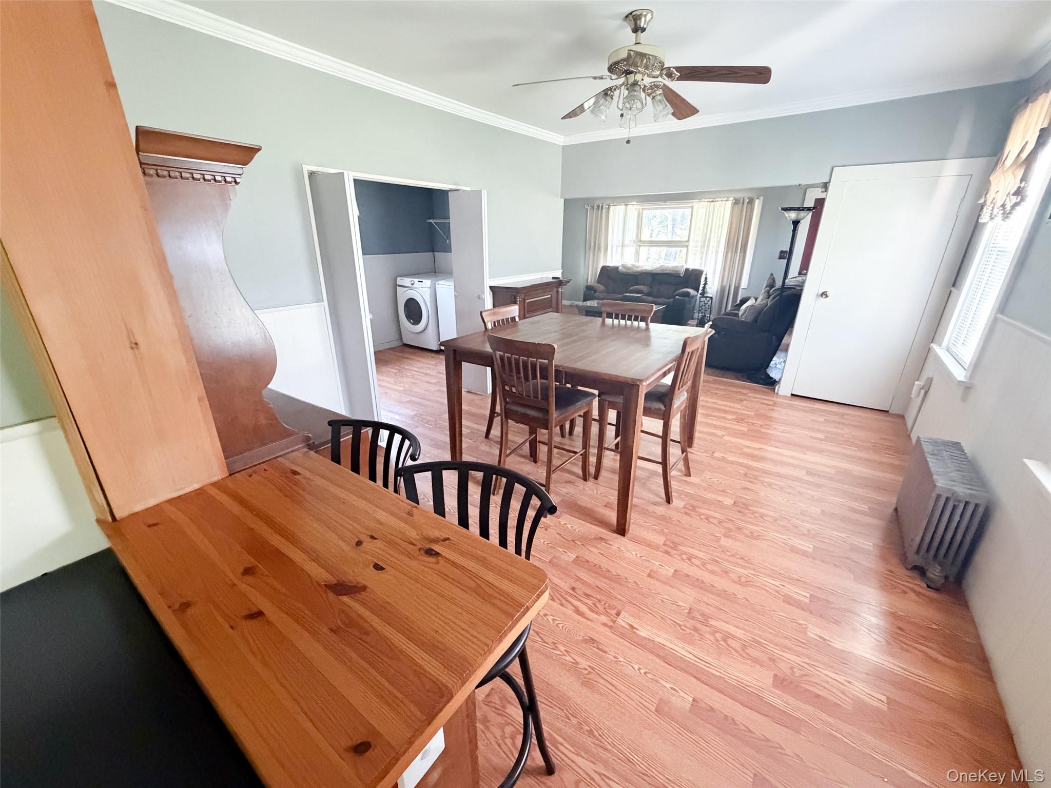 77 Rockland Road Roscoe, NY 12776 - Photo 4 of 20 Spacious open-concept living area featuring wood-finish flooring, a ceiling fan with light fixture, and white trim