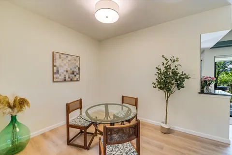 a view of a livingroom with furniture and a potted plant
