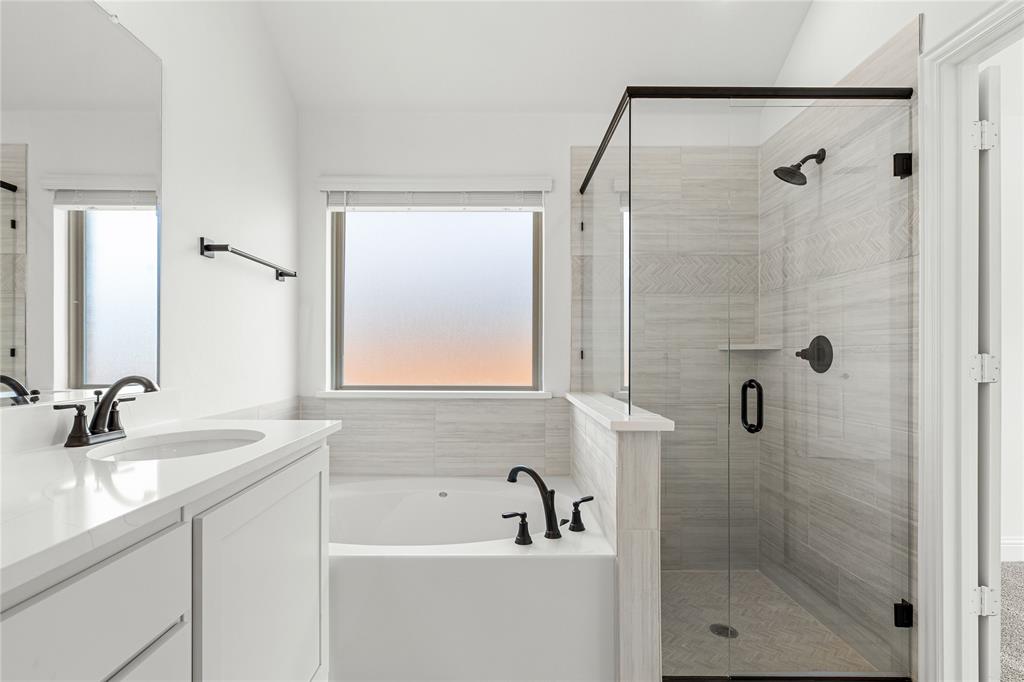 901 Split Oak Lane Anna, TX 75409 - Photo 21 of 31 a bathroom with a sink and a mirror