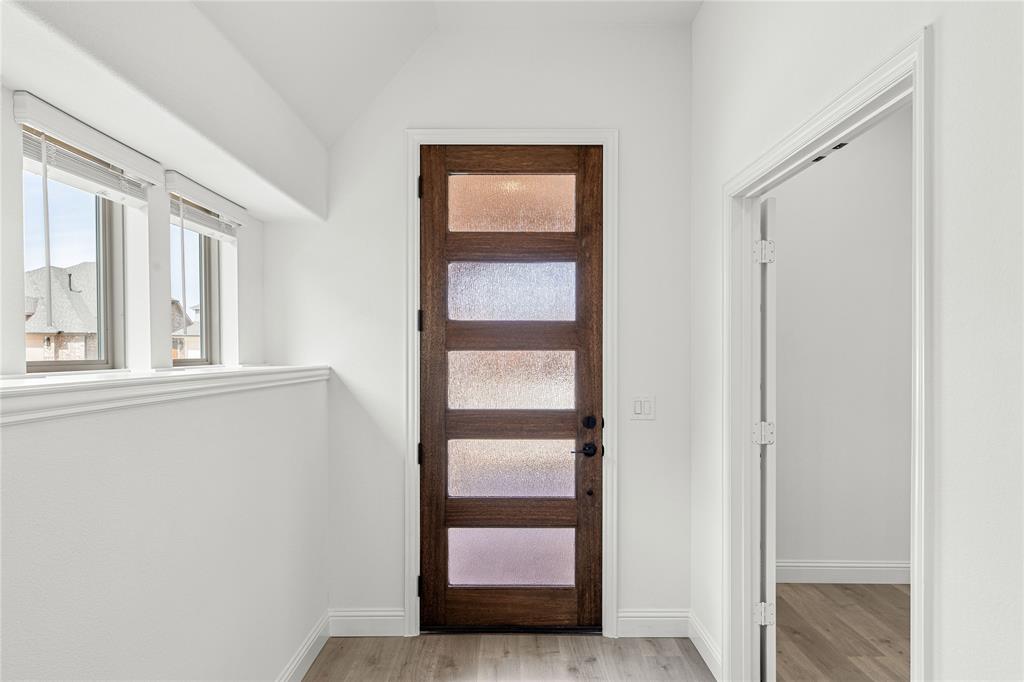 901 Split Oak Lane Anna, TX 75409 - Photo 4 of 31 a view of front door with wooden floor
