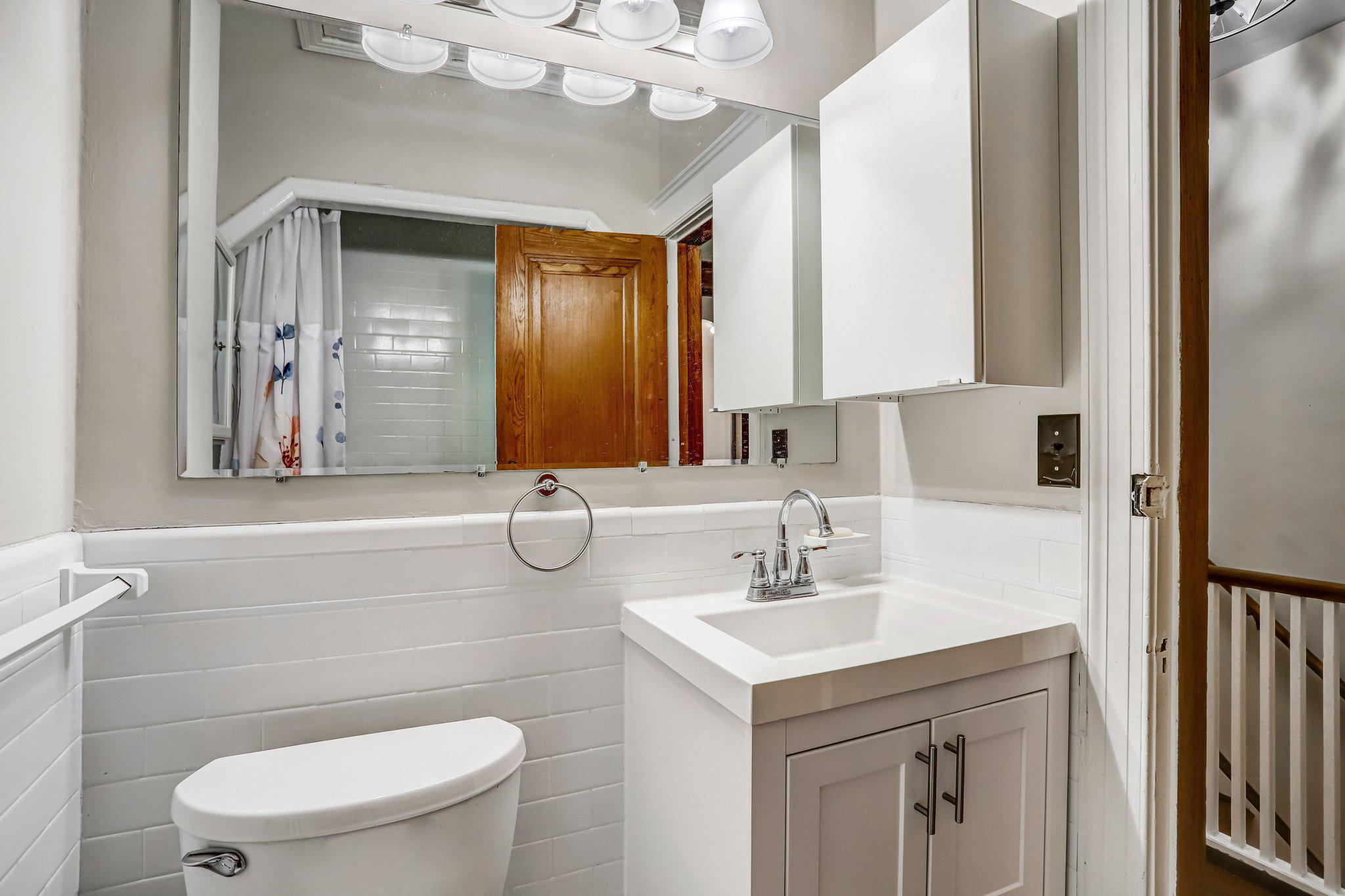 114 Madison Street Northwest Washington, DC 20011 - Photo 51 of 80 a bathroom with a sink vanity mirror and toilet