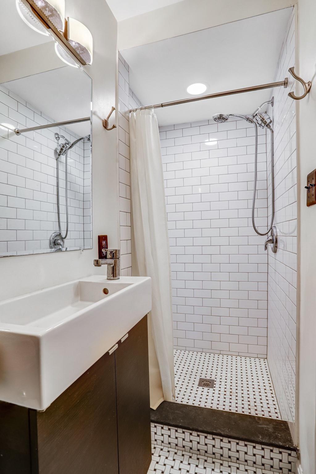 114 Madison Street Northwest Washington, DC 20011 - Photo 64 of 80 a bathroom with a sink a shower and a mirror