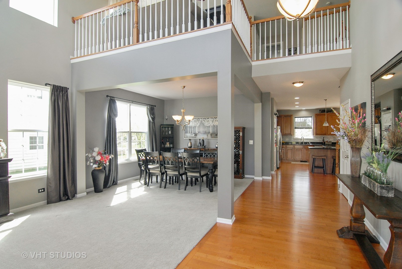 309 Monument Road Elgin, IL 60124 - Photo 4 of 25 a dining hall with couches a dining table and chairs with wooden floor
