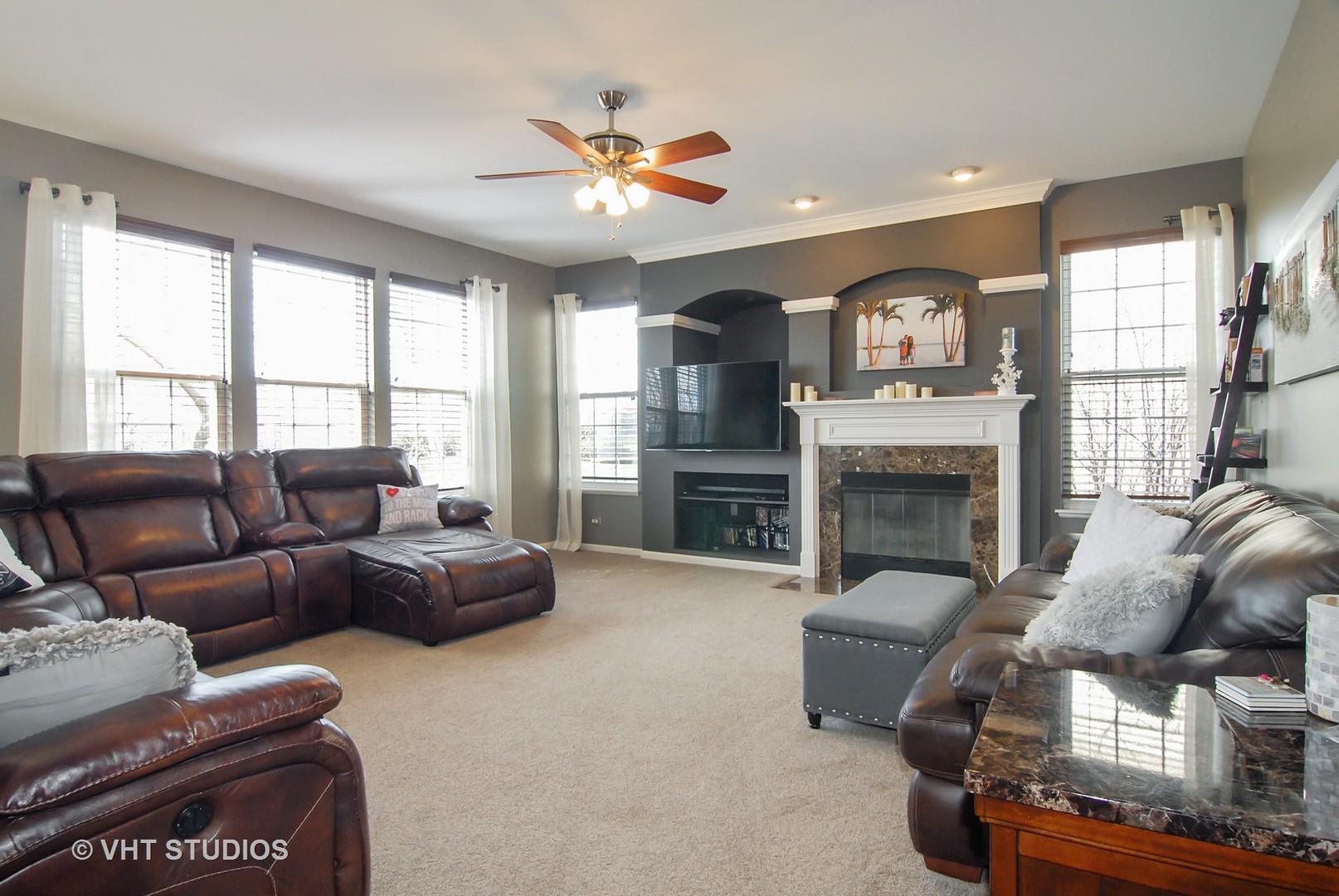 309 Monument Road Elgin, IL 60124 - Photo 10 of 25 a living room with furniture and a fireplace