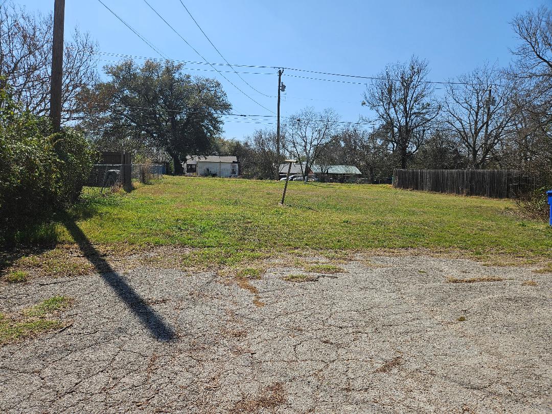 1130 North Main Street Elgin, TX 78621 - Photo 12 of 16 a view of a field with a fence
