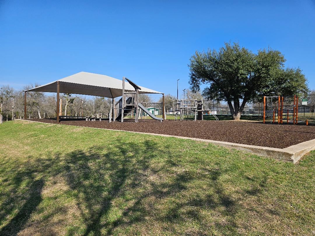 1130 North Main Street Elgin, TX 78621 - Photo 15 of 16 a view of a playground with a slide