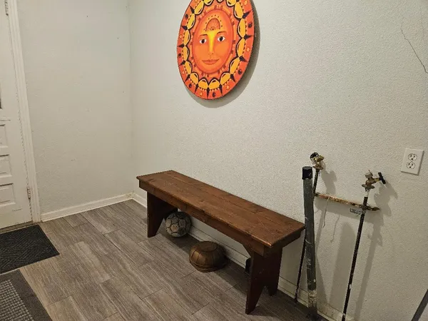 a room with a table and a chandelier