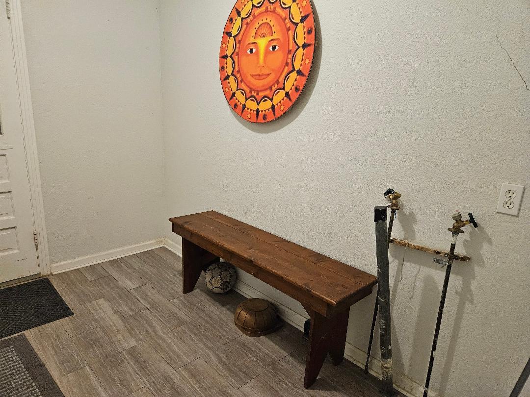 1130 North Main Street Elgin, TX 78621 - Photo 9 of 16 a room with a table and a chandelier