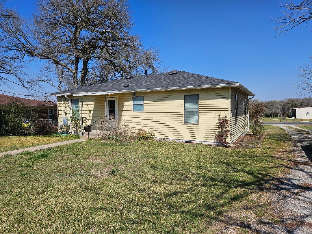 1130 North Main Street Elgin, TX 78621 - Photo 10 of 16 a view of a house with a yard