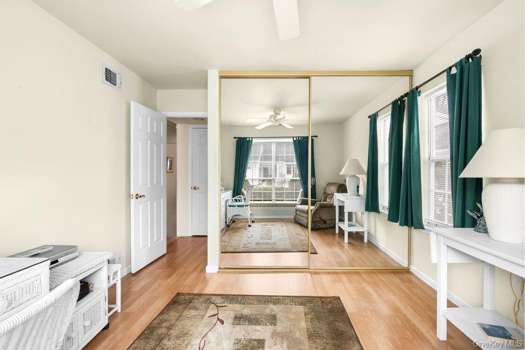 16 Huntington Court Ridge, NY 11961 - Photo 13 of 43 a large living room with a large window